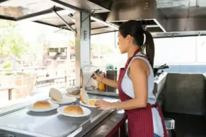 Lady Cooking In A Food Truck